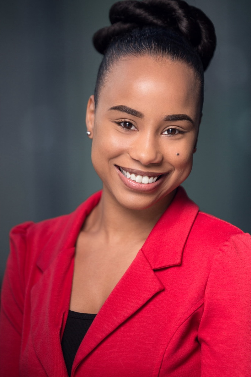 Jada Nicole Howard — headshot in a red blazer